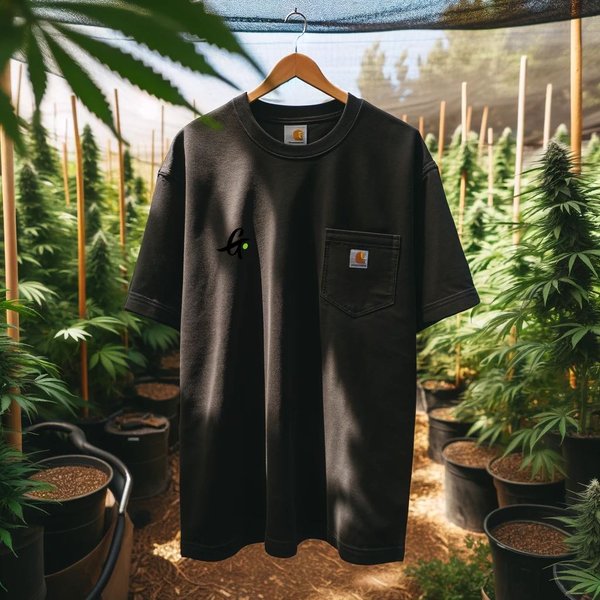 Black Carhartt Tall Workwear Pocket Tee hanging outdoors, showcasing its simple design with a single pocket and tall, loose fit, ideal for garden work.